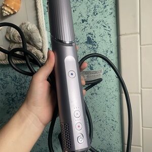 Sleek Silver Hair Styling Tool